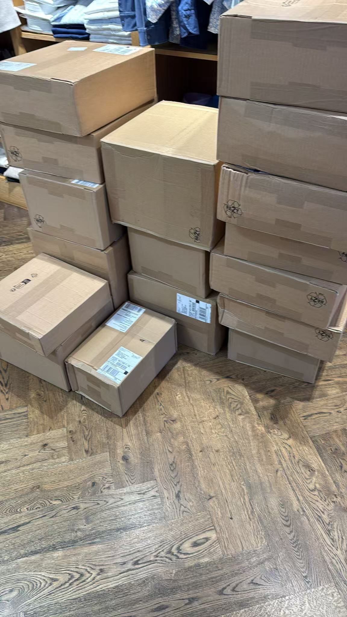 Multiple received cartons grouped together inside a storeroom