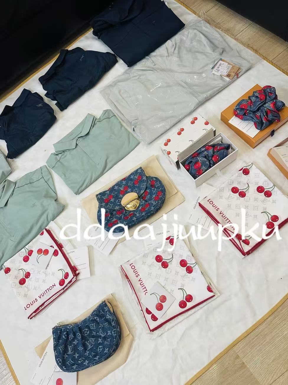 A curated selection of clothing, small bags and scarves