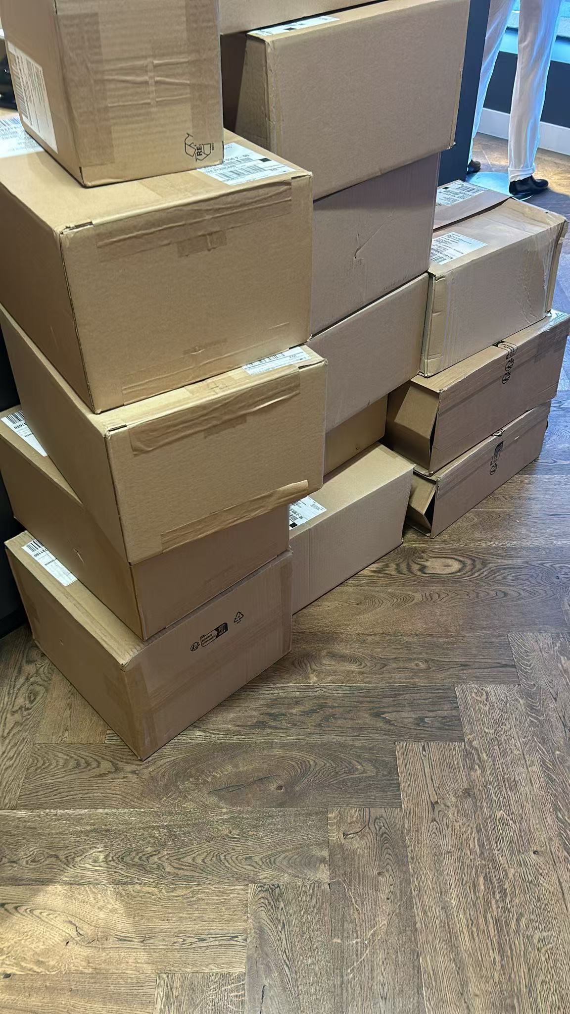 Shipping cartons arranged in groups during order sorting