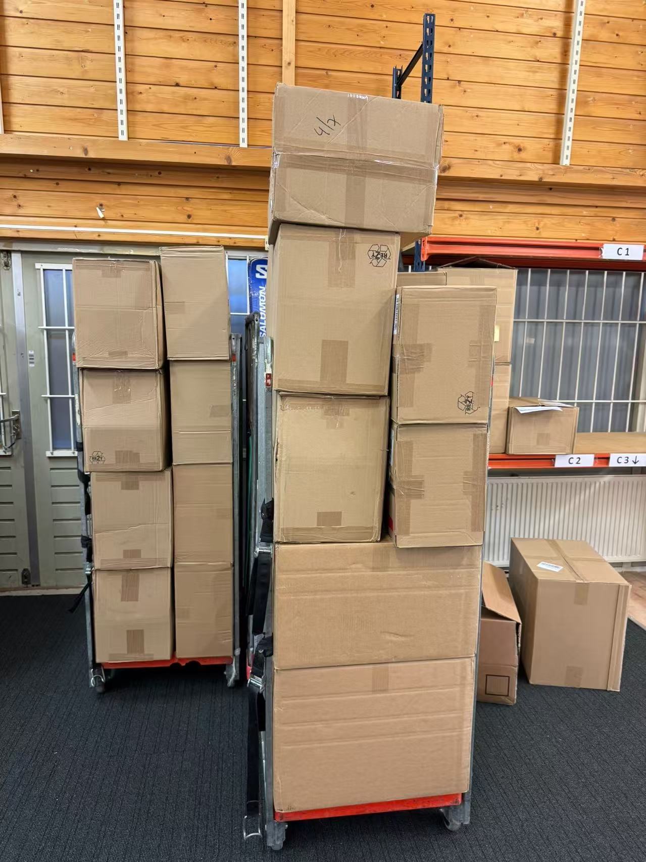 Cartons grouped on warehouse trolleys as part of an incoming goods operation