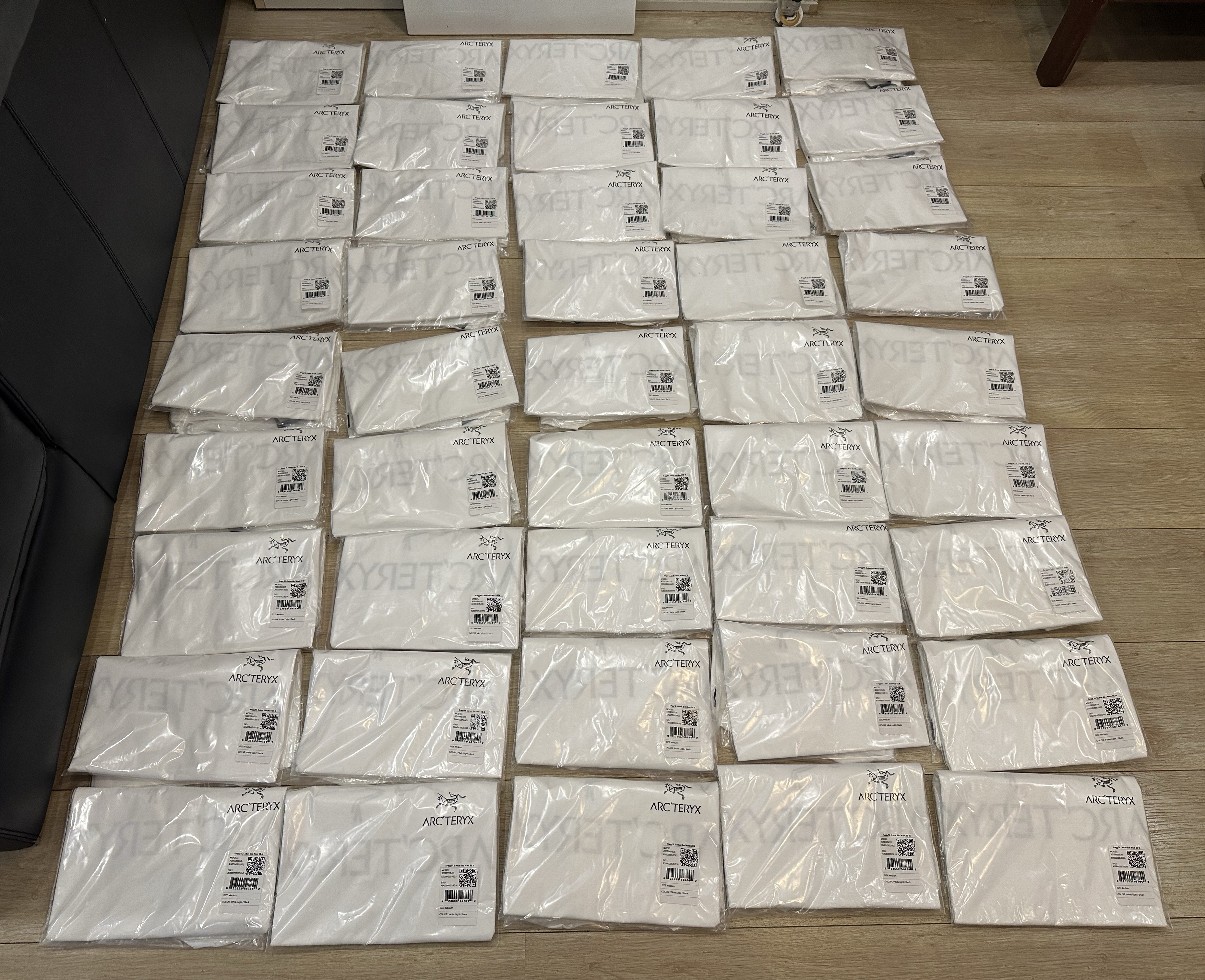 Rows of individually packed white apparel