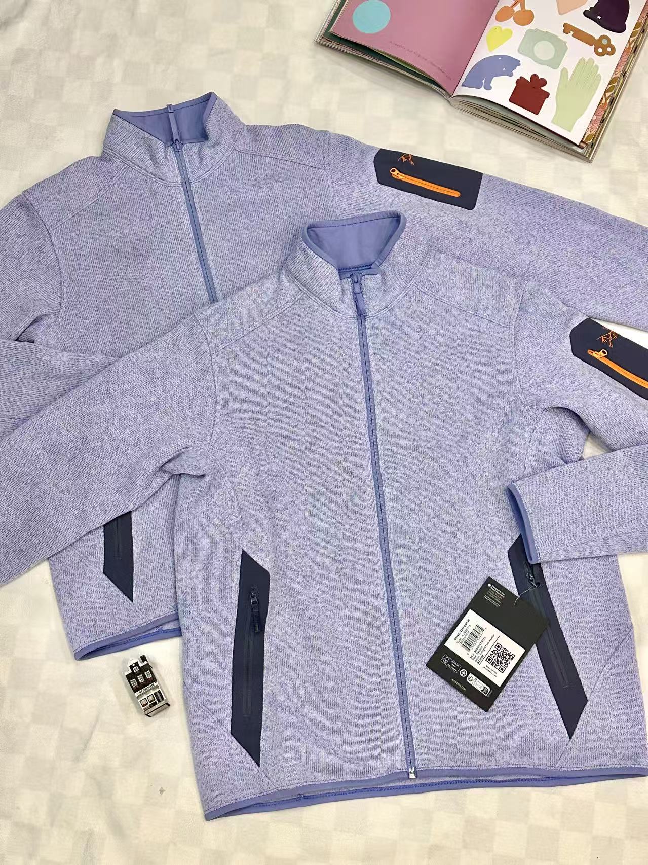 Lavender zip knitwear shown in two sizes